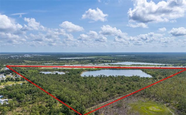 10740 Wheeler Place PUNTA GORDA, FL Plot of land Active - Photo 1 of 9. Opens carousel modal