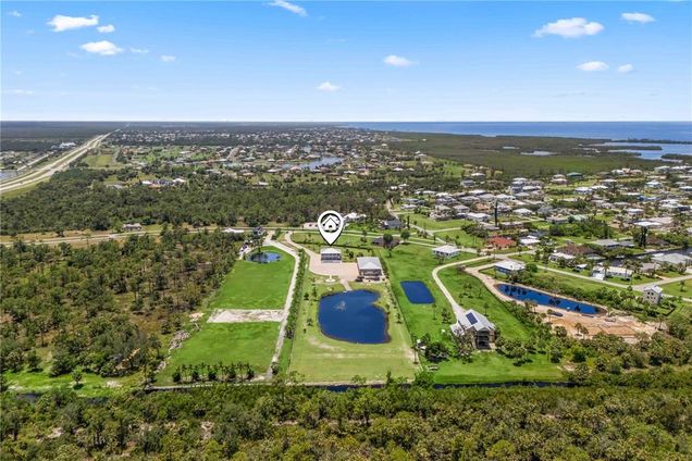 24490 Yacht Club Boulevard PUNTA GORDA, FL House Active - Photo 1 of 65. Opens carousel modal