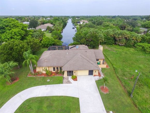 5087 Silver Bell Drive PORT CHARLOTTE, FL House Active - Photo 1 of 40. Opens carousel modal