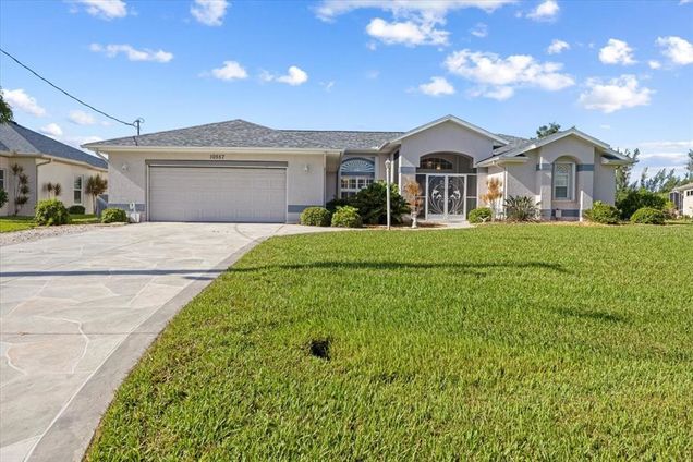 10557 Washington Road PORT CHARLOTTE, FL House Active - Photo 1 of 74. Opens carousel modal