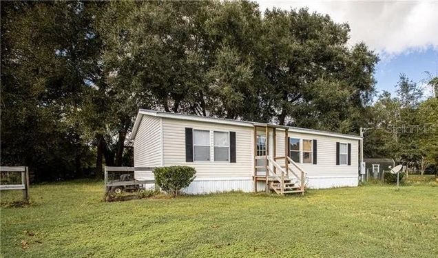 13162 SE 32nd Court BELLEVIEW, FL House Active - Photo 1 of 6. Opens carousel modal