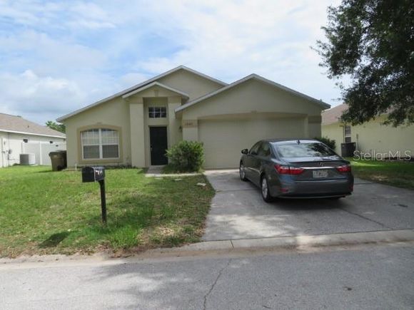 1040 Winding Water Way CLERMONT, FL House Active - Photo 1 of 18. Opens carousel modal