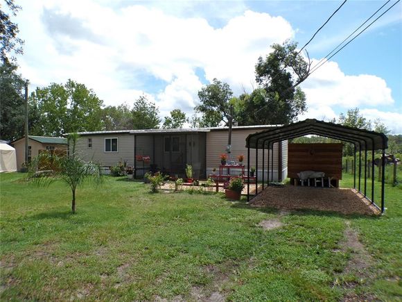 4975 SE 187th Court OCKLAWAHA, FL House Active - Photo 1 of 43. Opens carousel modal