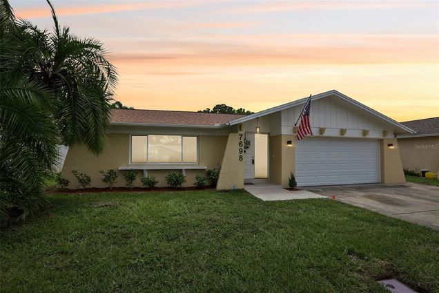 7698 Cardiff Court ST PETERSBURG, FL House Active - Photo 1 of 56. Opens carousel modal