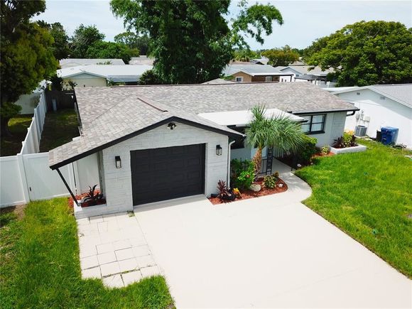 7111 Rockwood Drive PORT RICHEY, FL House Active - Photo 1 of 20. Opens carousel modal