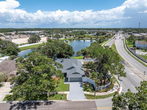7001 Hollowell Drive TAMPA, FL House Active - Photo 1 of 52. Opens carousel modal