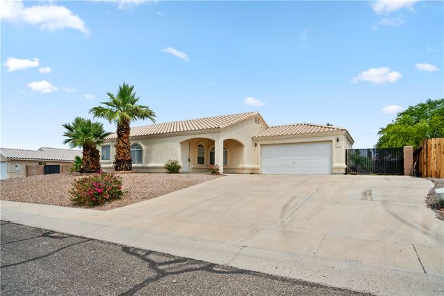 1797 E Brushy Creek Way Fort Mohave, AZ House Active - Photo 1 of 49. Opens carousel modal