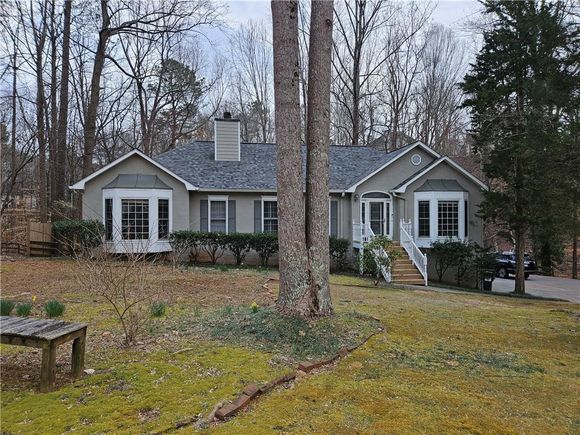 719 Lake Point Drive Woodstock, GA House Pending - Photo 1 of 38. Opens carousel modal