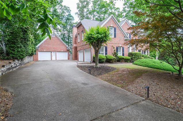 6450 Oak Valley Drive Cumming, GA House Active - Photo 1 of 84. Opens carousel modal