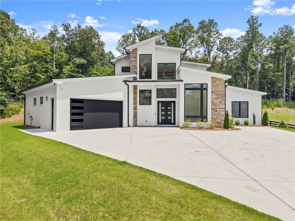 1676 Thomas Drive Hoschton, GA House Active - Photo 1 of 67. Opens carousel modal