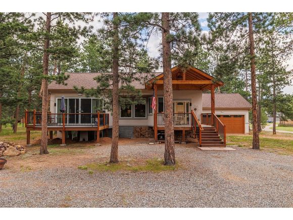 1251 Woodland Valley Ranch Dr Woodland Park, CO House Active - Photo 1 of 28. Opens carousel modal