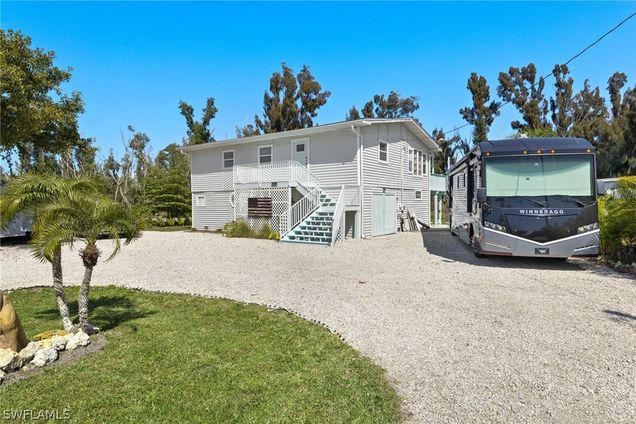 10880 Russell Road Bokeelia, FL House Sold - Photo 1 of 26. Opens carousel modal