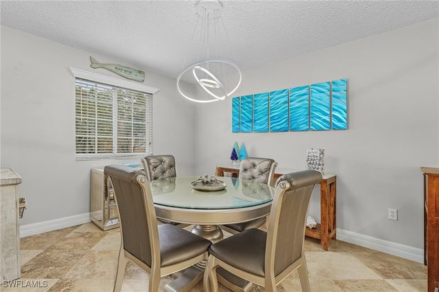 1180 Wildwood Lakes Boulevard Unit 208 Naples, FL Condo Active - Photo 1 of 32. Opens carousel modal