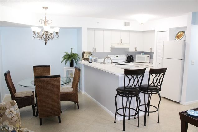 1235 Wildwood Lakes Boulevard Unit 4-104 Naples, FL Condo Active - Photo 1 of 12. Opens carousel modal