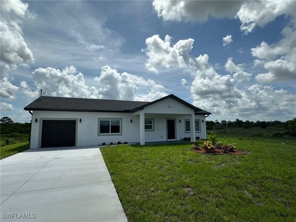 961 Countess Avenue Lehigh Acres, FL House Active - Photo 1 of 9. Opens carousel modal