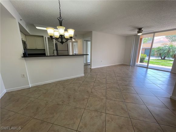 1210 Wildwood Lakes Boulevard Unit 105 Naples, FL Condo Active - Photo 1 of 23. Opens carousel modal