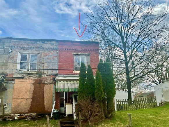 348 W 11th Ave Homestead, PA House Contingent - Photo 1 of 19. Opens carousel modal