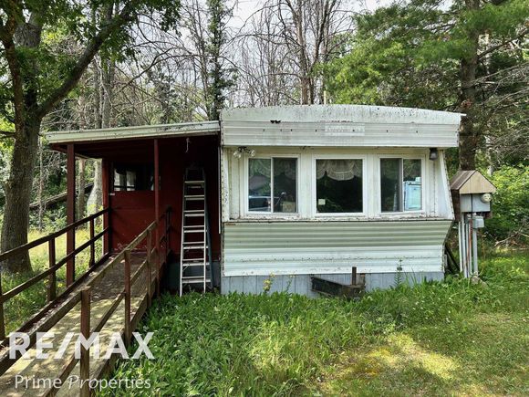 91 Otter Ct Court Roscommon, MI House Active - Photo 1 of 48. Opens carousel modal