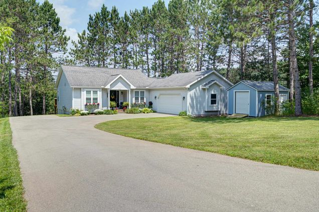 7070 Appollo Lake Lane TraverseCity, MI House Active - Photo 1 of 55. Opens carousel modal