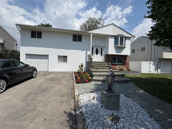 378 W Waukena Avenue Oceanside, NY House Active - Photo 1 of 17. Opens carousel modal
