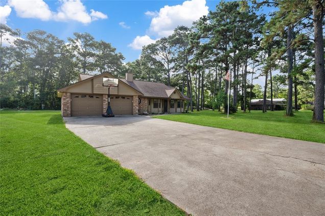 13985 Lillard Lane Old River-Winfree, TX House Active - Photo 1 of 24. Opens carousel modal