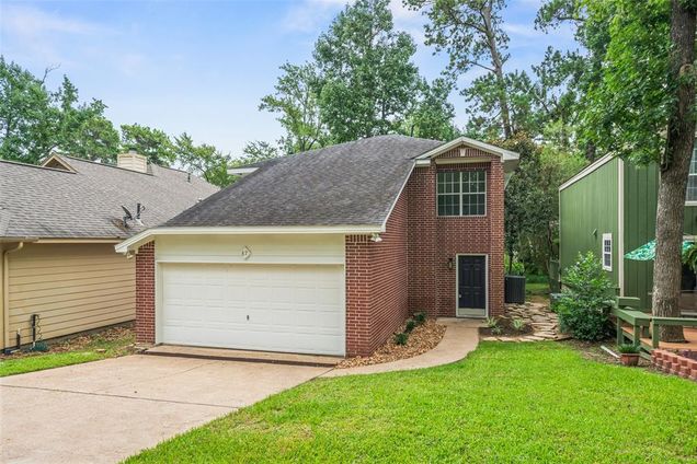 87 April Wind Drive N Conroe, TX House Active - Photo 1 of 32. Opens carousel modal