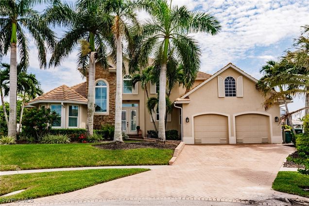 1045 Cottonwood Court Marco Island, FL House Active - Photo 1 of 47. Opens carousel modal