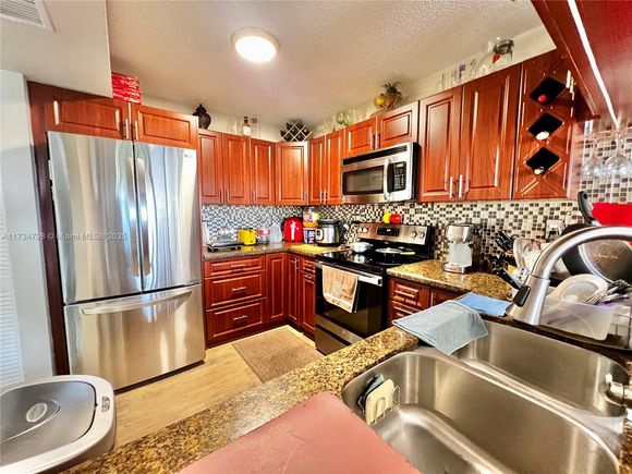 6305 Gage Pl Unit A-307 Miami Lakes, FL Condo Contingent - Photo 1 of 18. Opens carousel modal