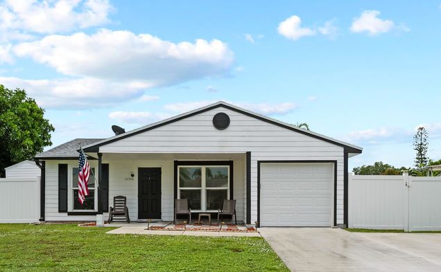10566 Aquarius Lane Royal Palm Beach, FL House Active - Photo 1 of 21. Opens carousel modal