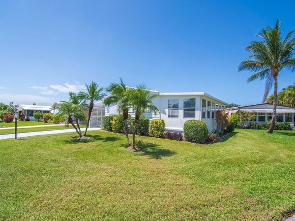 66 NE Pinelake Village Boulevard Jensen Beach, FL House Active - Photo 1 of 42. Opens carousel modal
