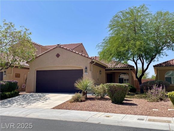 7421 Ravines Avenue Las Vegas, NV House Active - Photo 1 of 20. Opens carousel modal