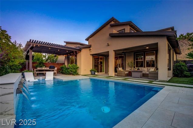 9702 Starlight Ridge Avenue Las Vegas, NV House Active - Photo 1 of 61. Opens carousel modal