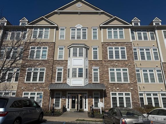 1304 Cedar Village Boulevard Unit 304 East Brunswick, NJ Townhouse Active - Photo 1 of 30. Opens carousel modal