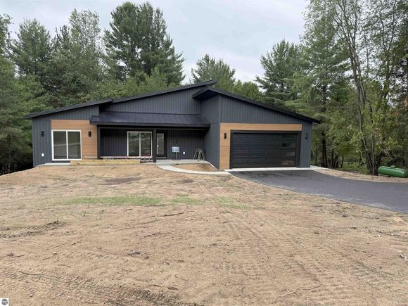 9769 Cushman Court Unit 20 Williamsburg, MI House Sold - Photo 1 of 23. Opens carousel modal