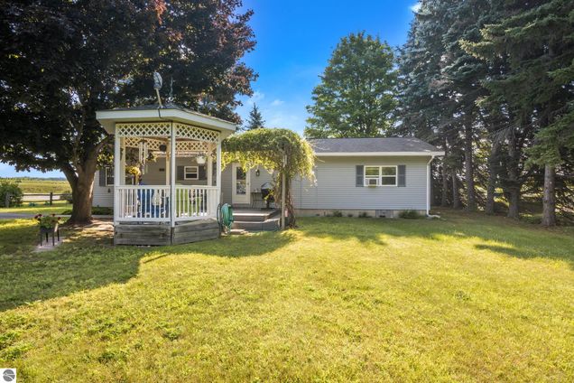 10892 E Murray Court Suttons Bay, MI House Active - Photo 1 of 29. Opens carousel modal