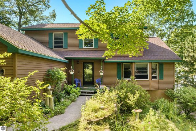 2884 Wild Juniper Trail Traverse City, MI House Active - Photo 1 of 35. Opens carousel modal
