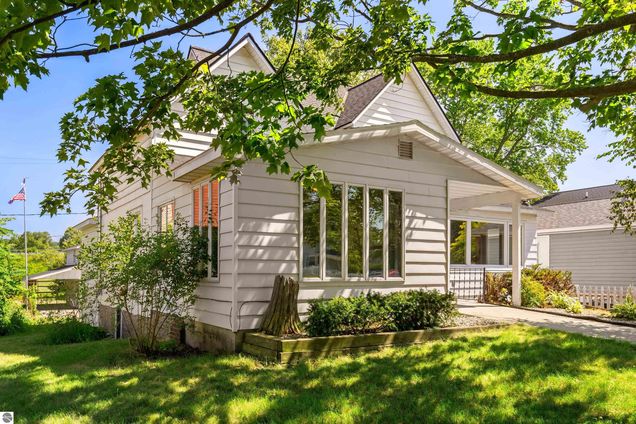 123 S Benzie Boulevard Beulah, MI House Active - Photo 1 of 45. Opens carousel modal