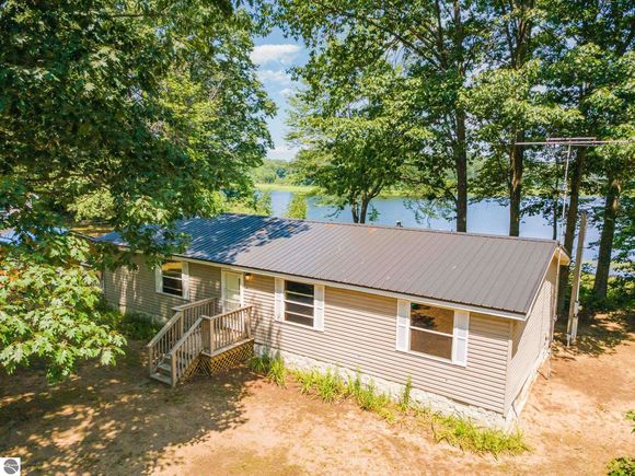 5696 S Lake Shore Drive Remus, MI House Active - Photo 1 of 32. Opens carousel modal